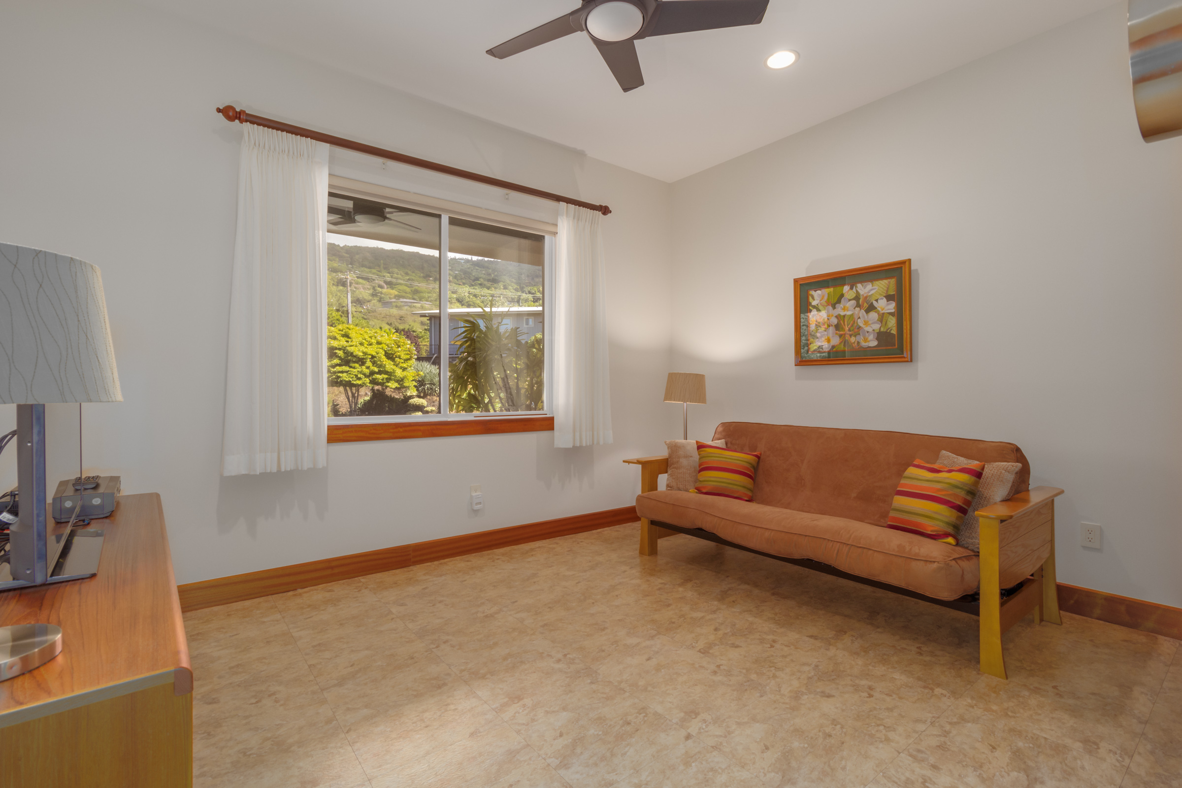 82-1171 Meli Road Captain Cook, HI 96704 - Photo 18 of 29 a living room with furniture and a window