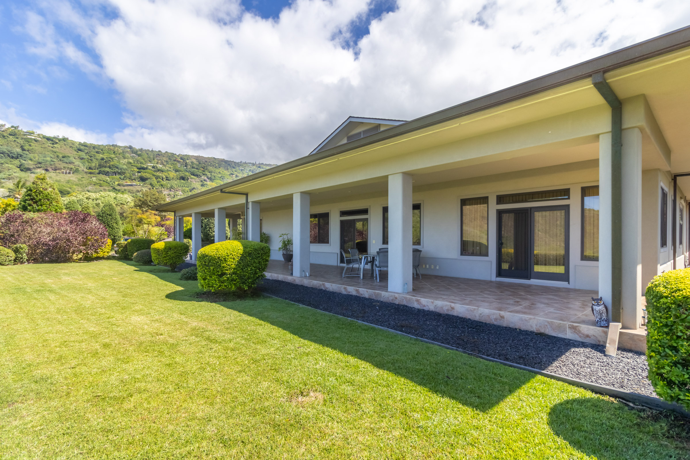 82-1171 Meli Road Captain Cook, HI 96704 - Photo 24 of 29 a view of a house with backyard porch and sitting area