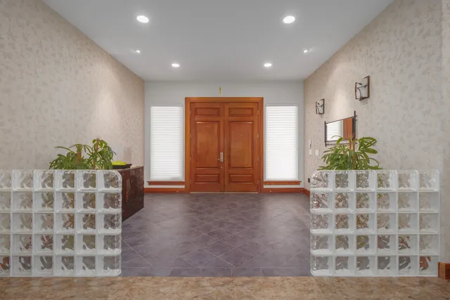 a large living room with furniture and a flat screen tv