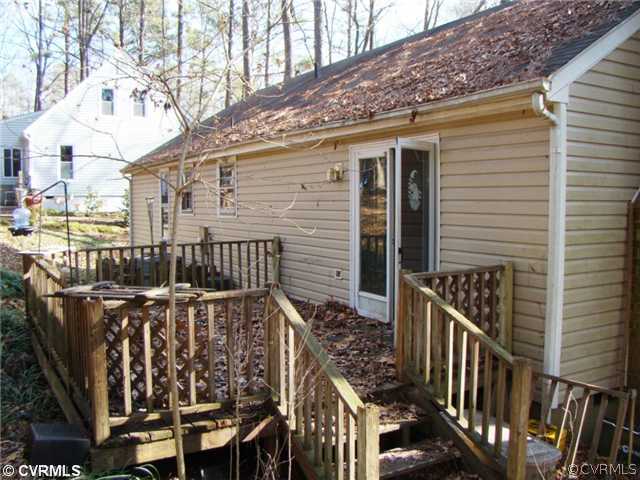 13210 Court Ridge Road Midlothian, VA 23112 - Photo 2 of 8 a view of wooden house with large windows