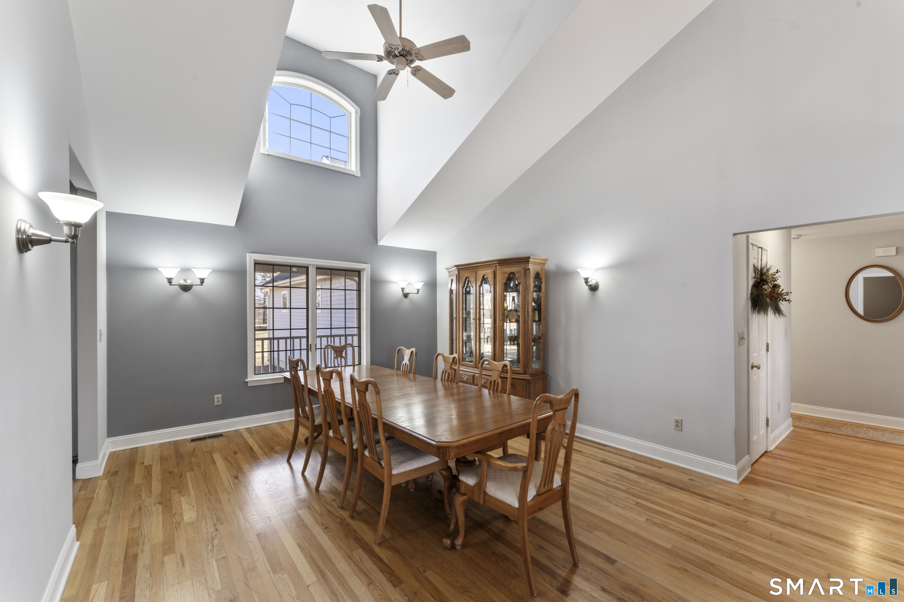 a view of a dining room with furniture and wooden floor