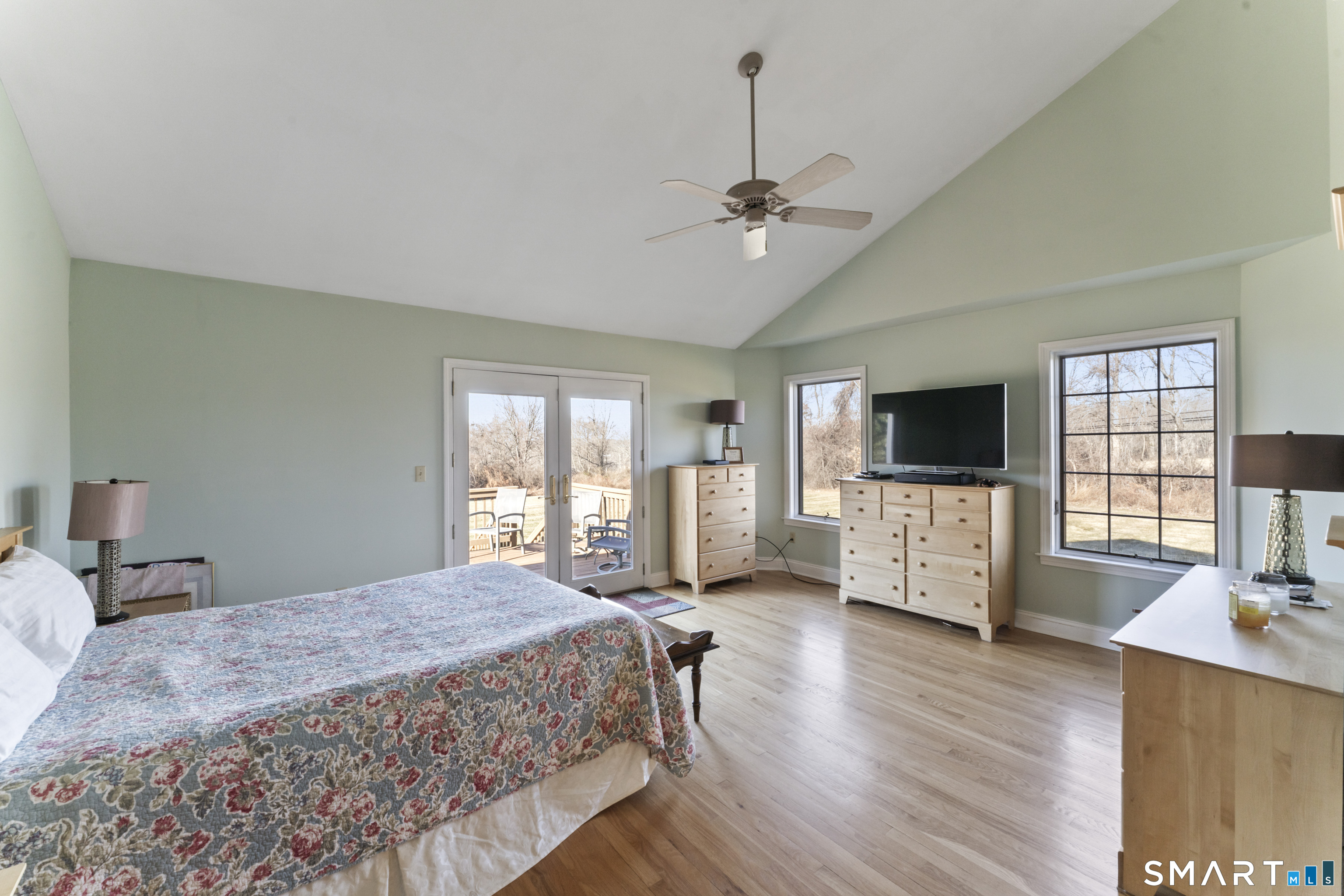 7 Lower County Road Roxbury, CT 06783 - Photo 15 of 40 a spacious bedroom with a bed and a flat screen tv