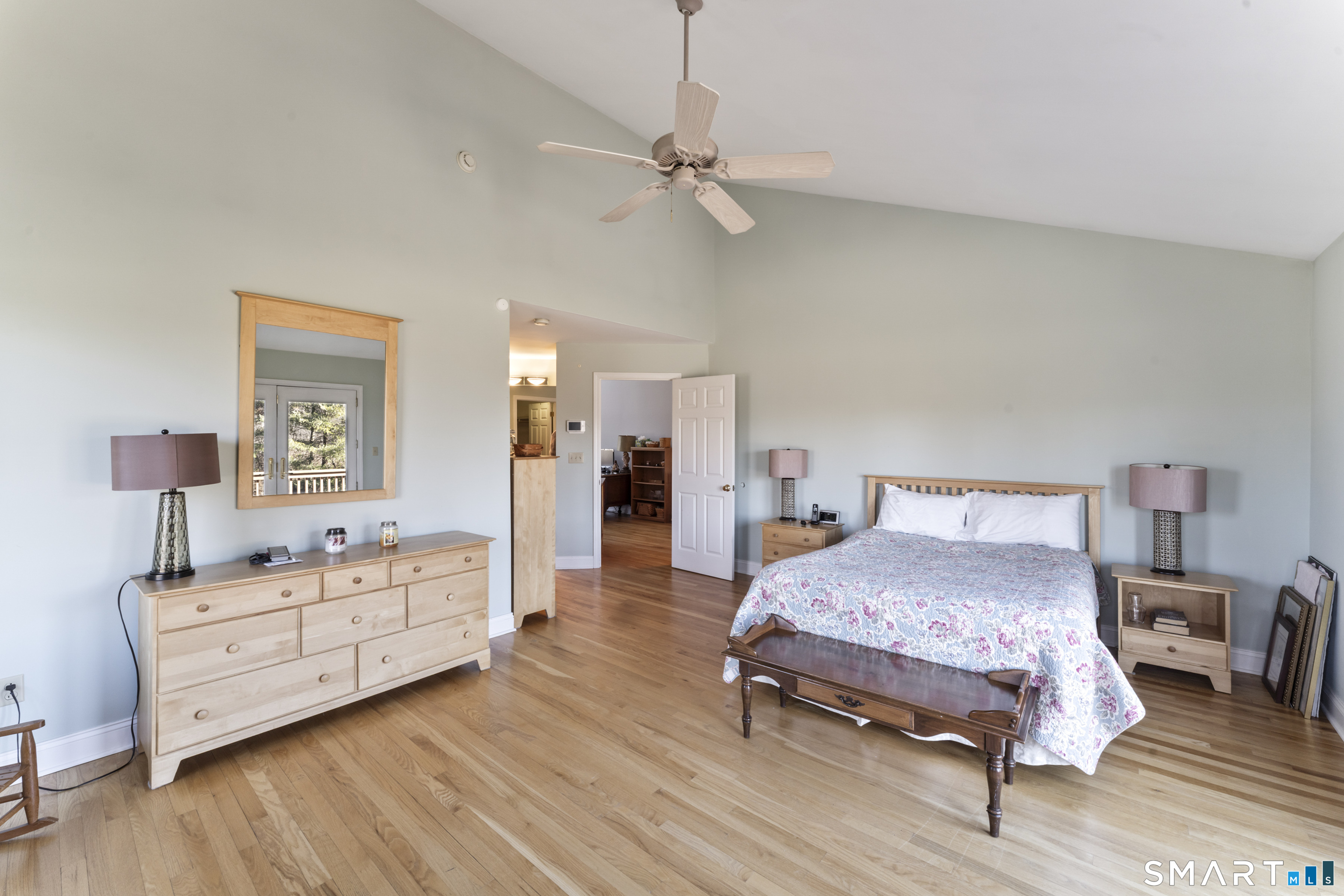 7 Lower County Road Roxbury, CT 06783 - Photo 16 of 40 a bedroom with a bed and a chandelier