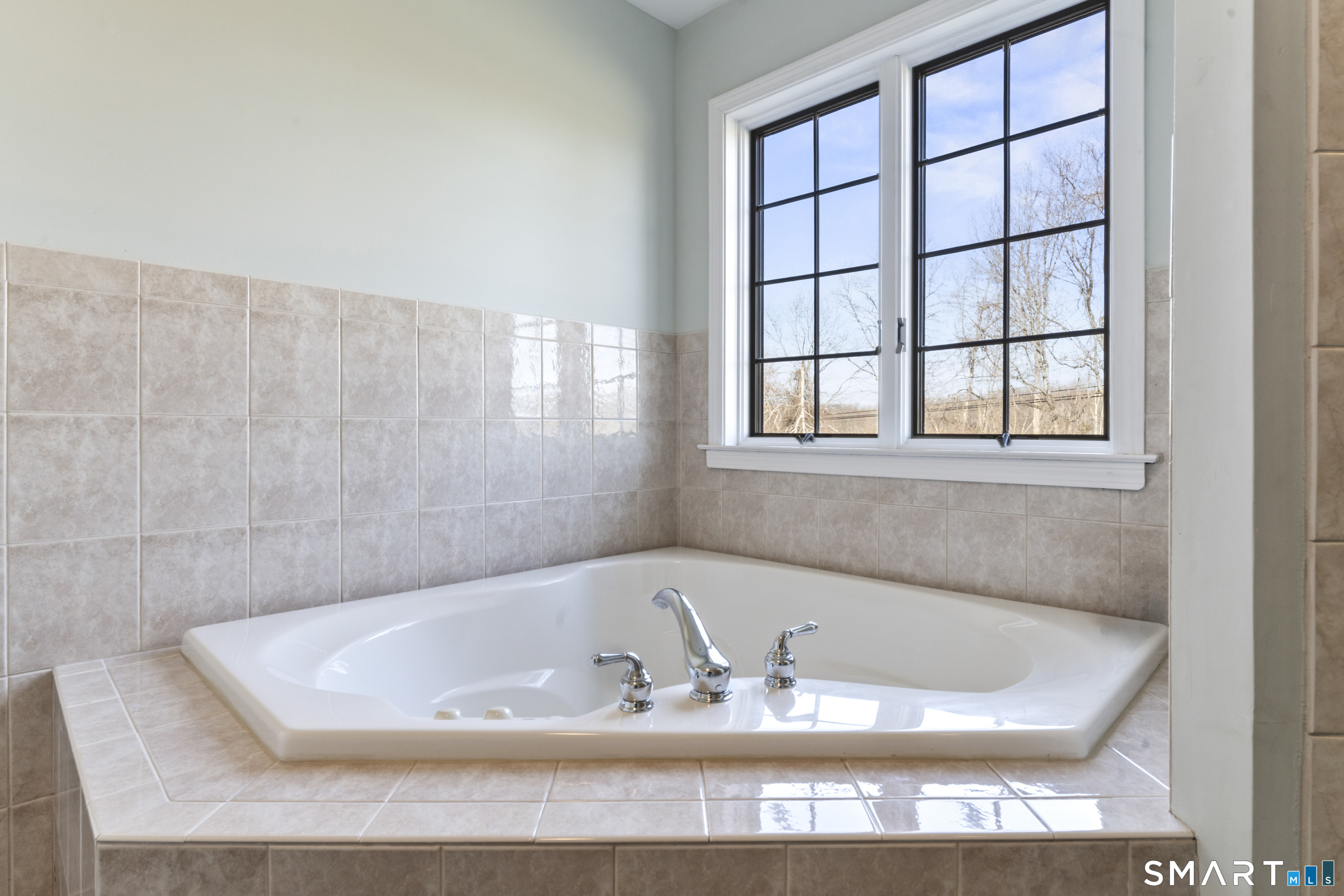 7 Lower County Road Roxbury, CT 06783 - Photo 20 of 40 a bath tub sitting in a bathroom next to a window