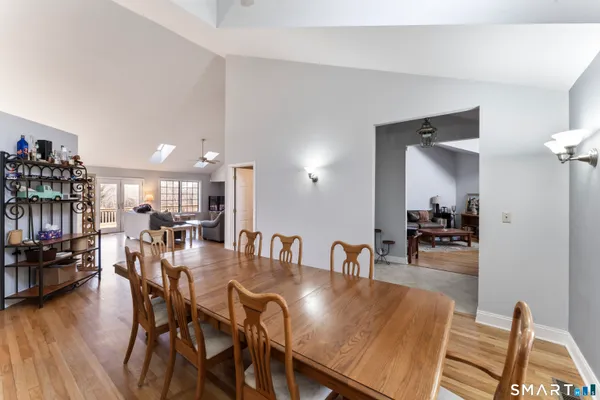 a view of a dining room with furniture and wooden floor