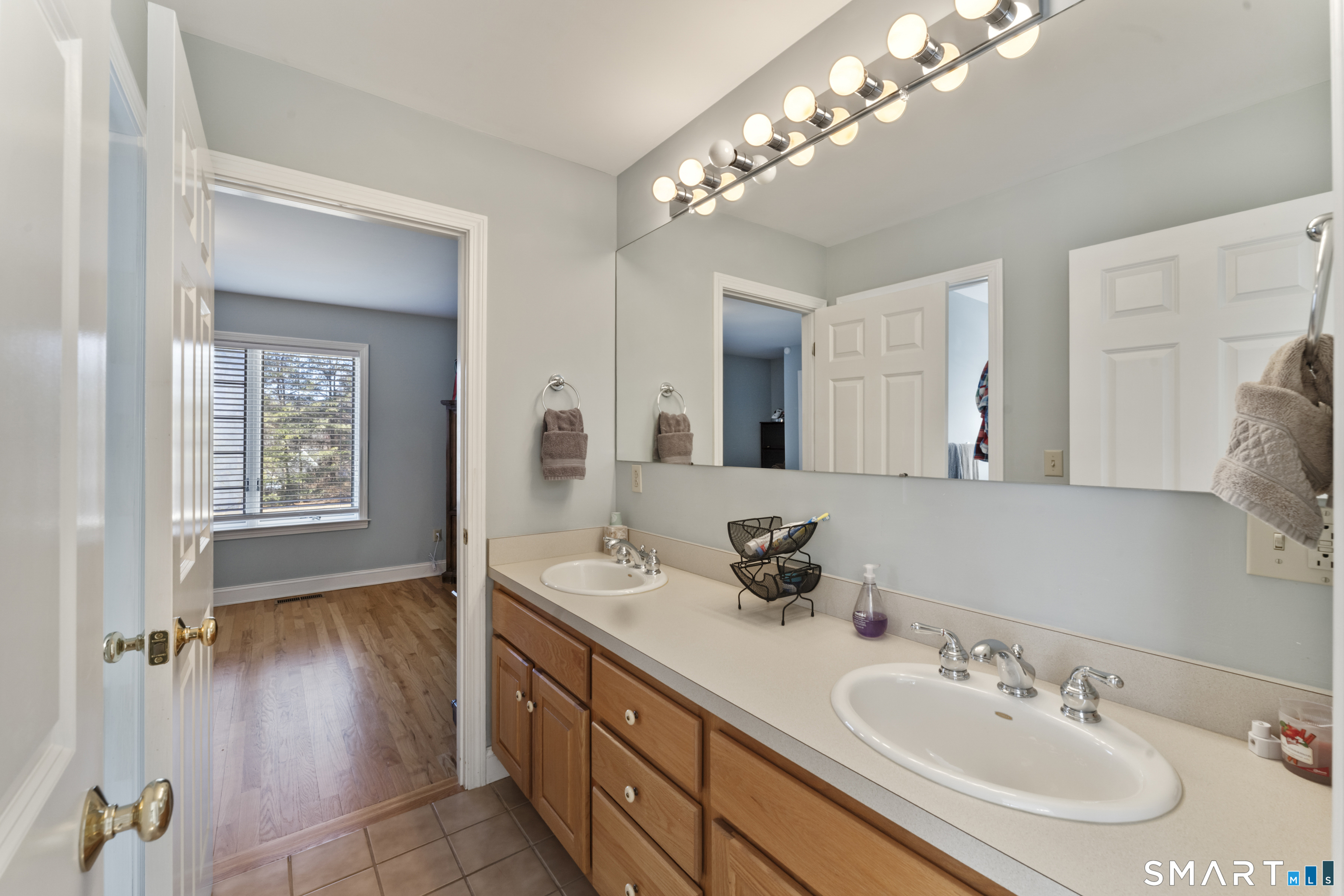 7 Lower County Road Roxbury, CT 06783 - Photo 24 of 40 a bathroom with a sink double vanity and a mirror