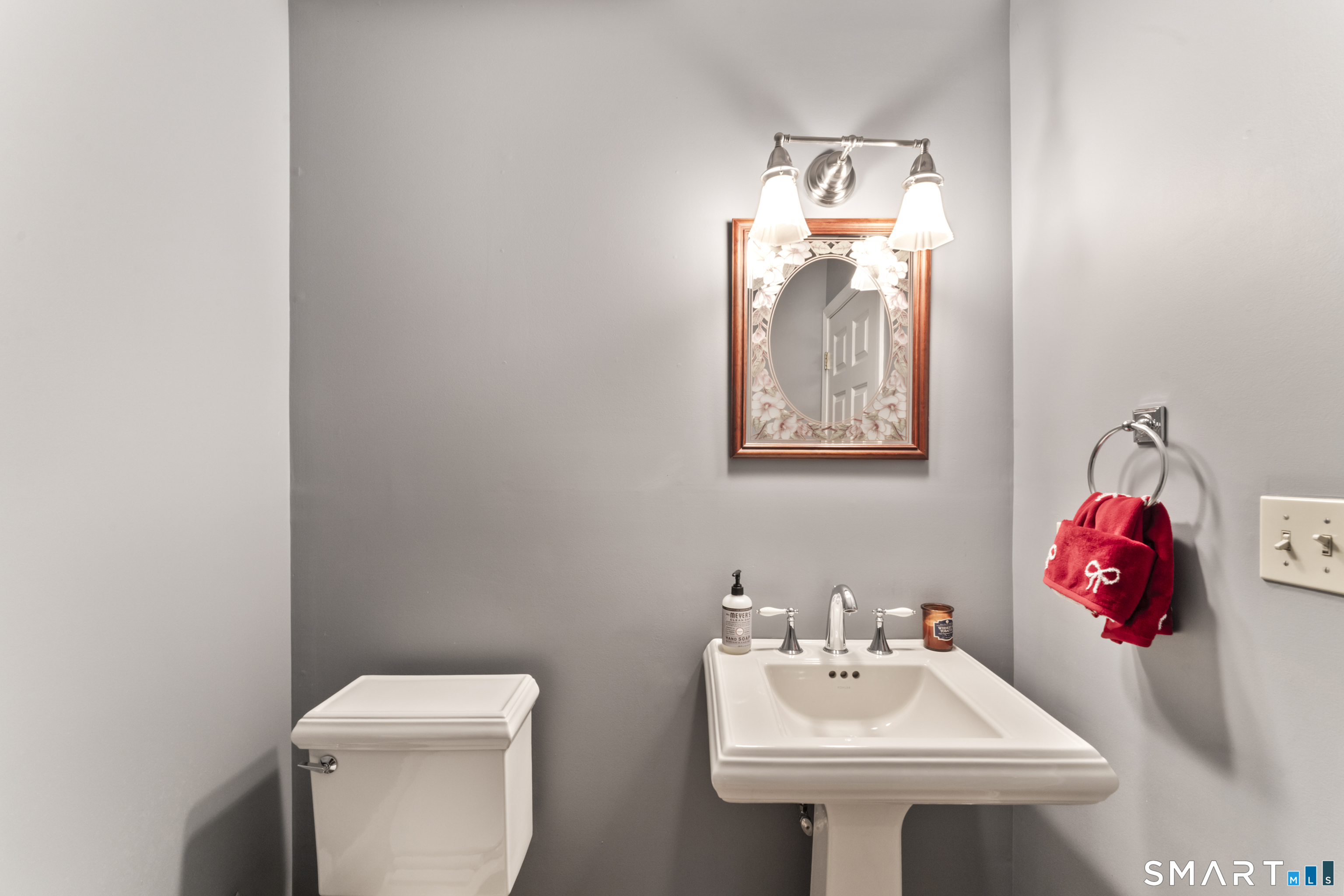 7 Lower County Road Roxbury, CT 06783 - Photo 28 of 40 a bathroom with a sink mirror and toilet