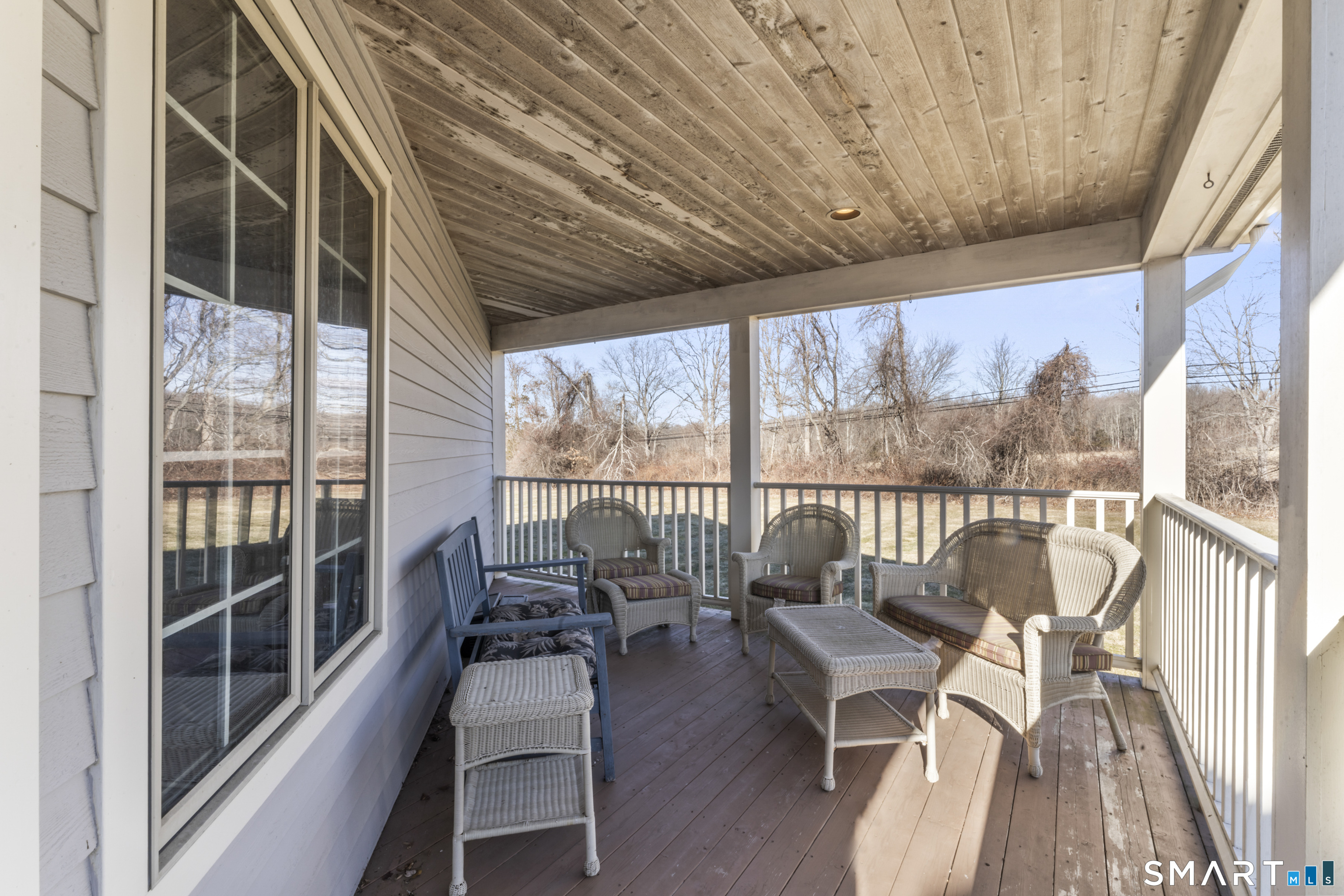 7 Lower County Road Roxbury, CT 06783 - Photo 30 of 40 a dining room with wooden floor and furniture