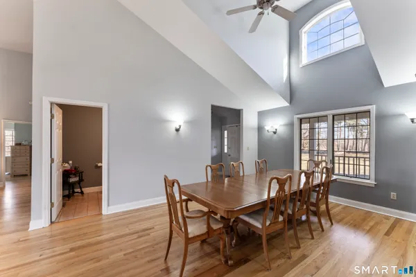 a view of a dining room with furniture and wooden floor