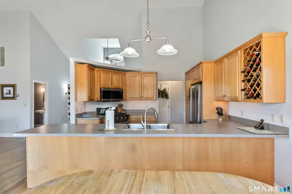 a kitchen with a sink and large window