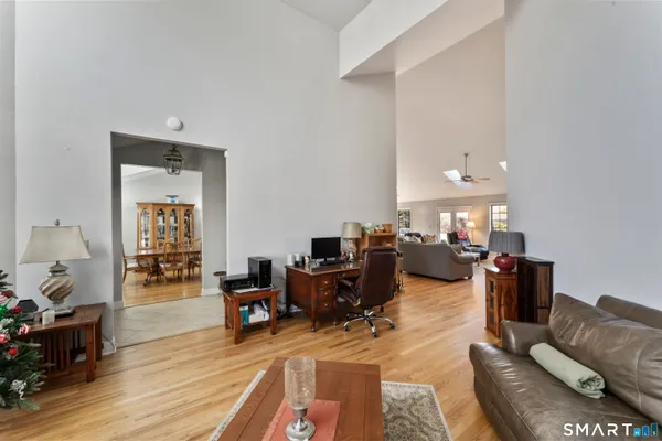 a living room with furniture and wooden floor