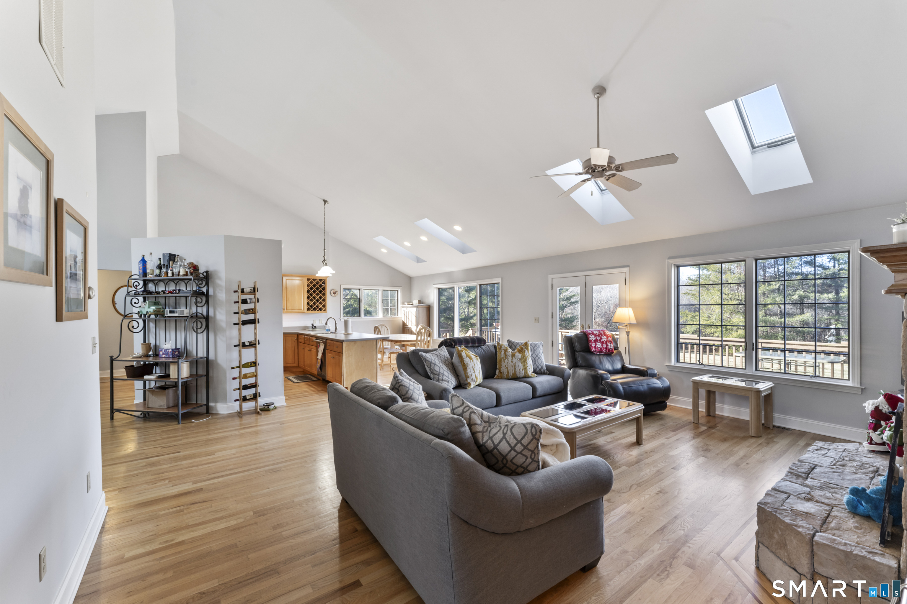 7 Lower County Road Roxbury, CT 06783 - Photo 4 of 40 a living room with furniture kitchen view and a wooden floor