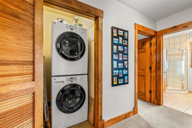 a view of a hallway with washer and dryer