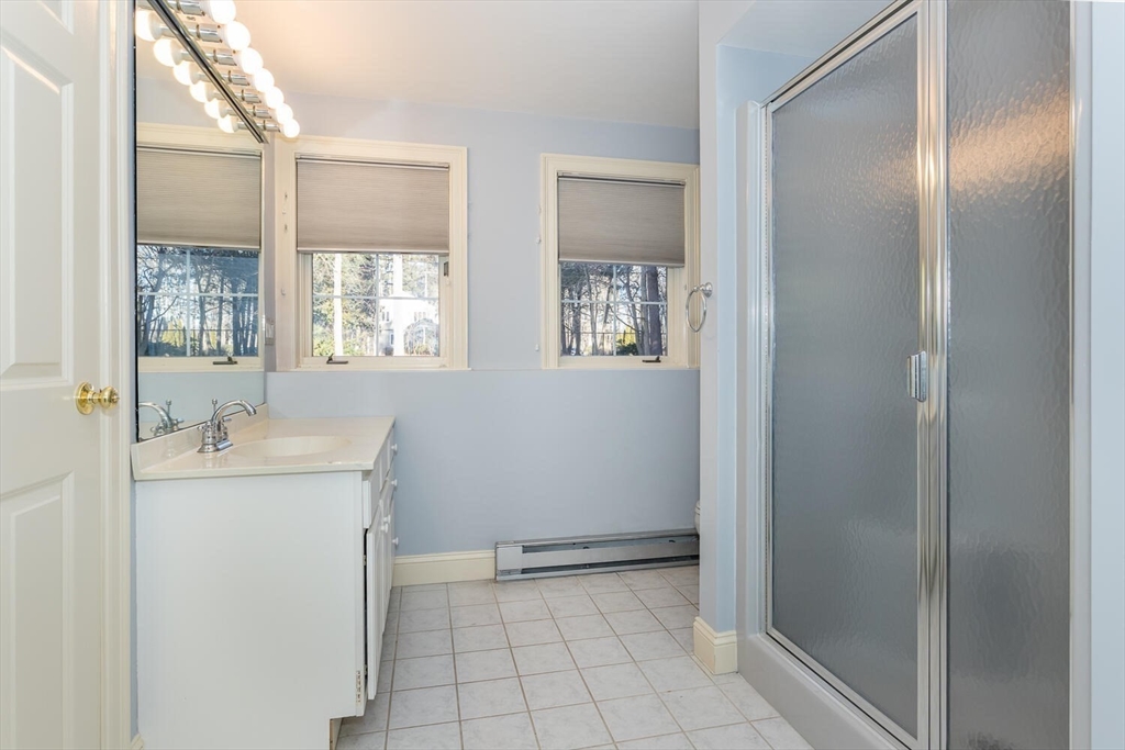15 Weathervane Road Canton, MA 02021 - Photo 22 of 31 a bathroom with a sink a toilet and shower