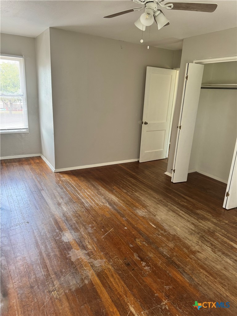 3001 East Rio Grande Street Victoria, TX 77901 - Photo 13 of 20 an empty room with wooden floor and a window
