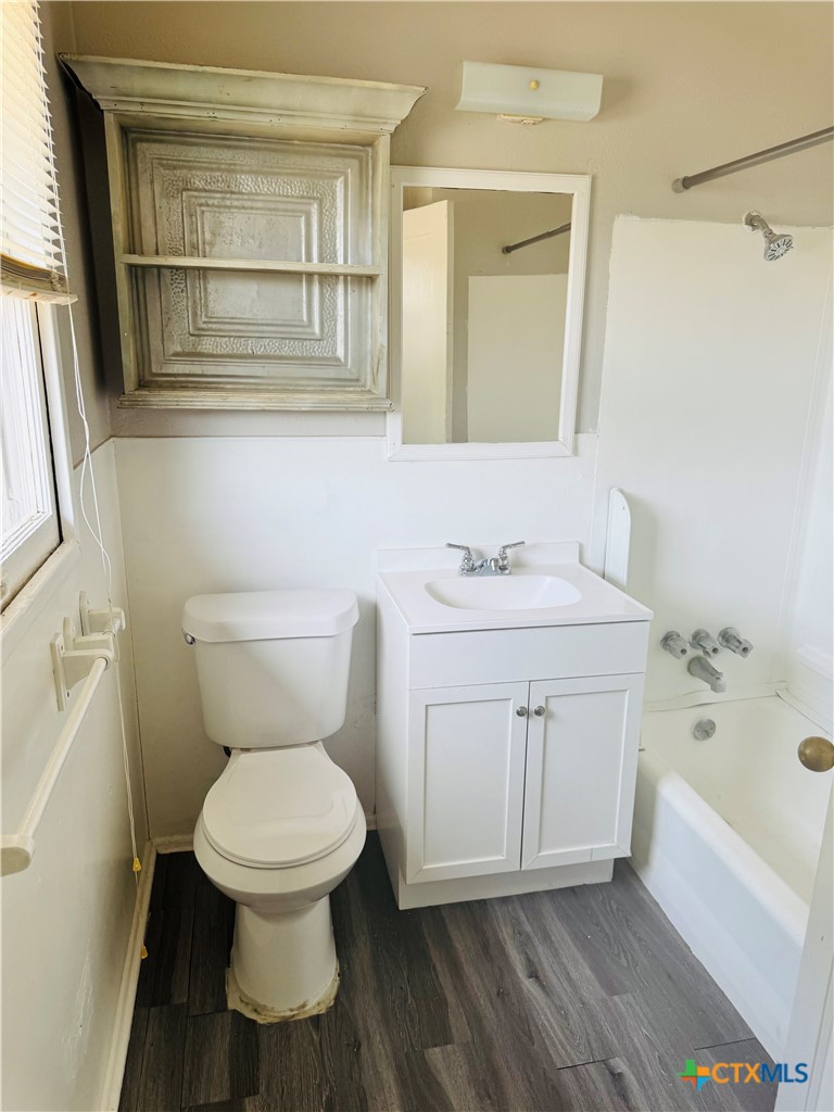 3001 East Rio Grande Street Victoria, TX 77901 - Photo 14 of 20 a white toilet sitting next to a bathroom sink
