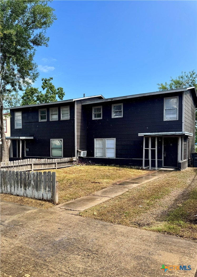3001 East Rio Grande Street Victoria, TX 77901 - Photo 2 of 20 a front view of a house with a yard