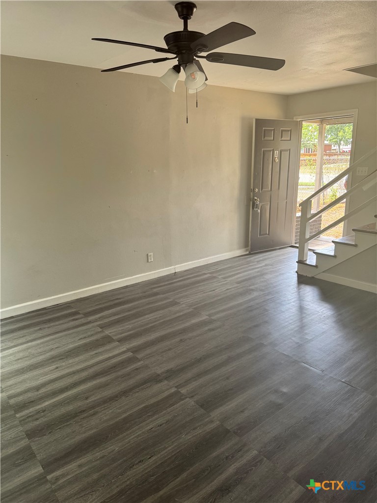 3001 East Rio Grande Street Victoria, TX 77901 - Photo 3 of 20 wooden floor in an empty room with a window