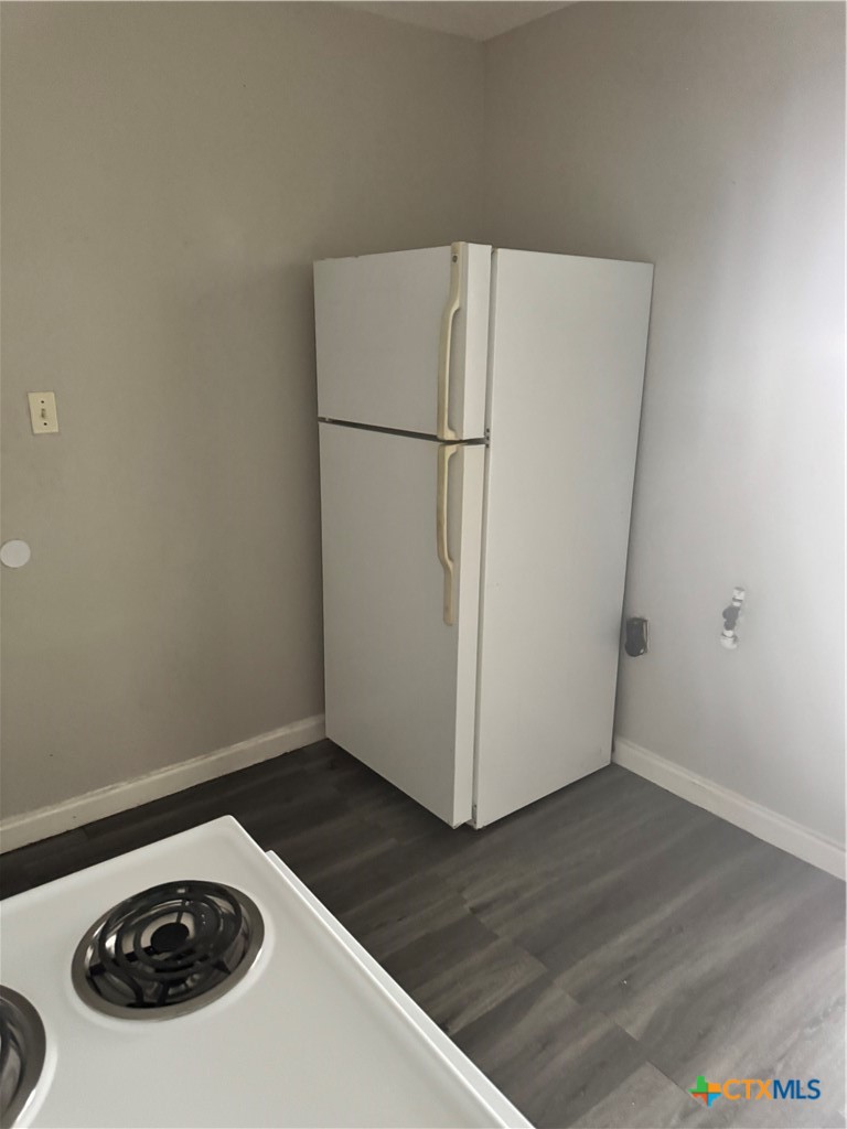 3001 East Rio Grande Street Victoria, TX 77901 - Photo 10 of 20 a white refrigerator freezer sitting in a kitchen