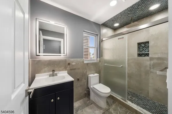 a bathroom with a toilet sink and shower