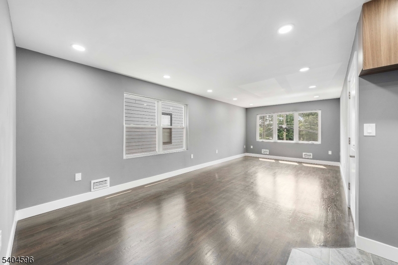 1117 Chestnut Street Elizabeth, NJ 07201 - Photo 14 of 23 a view of an empty room with wooden floor and a window