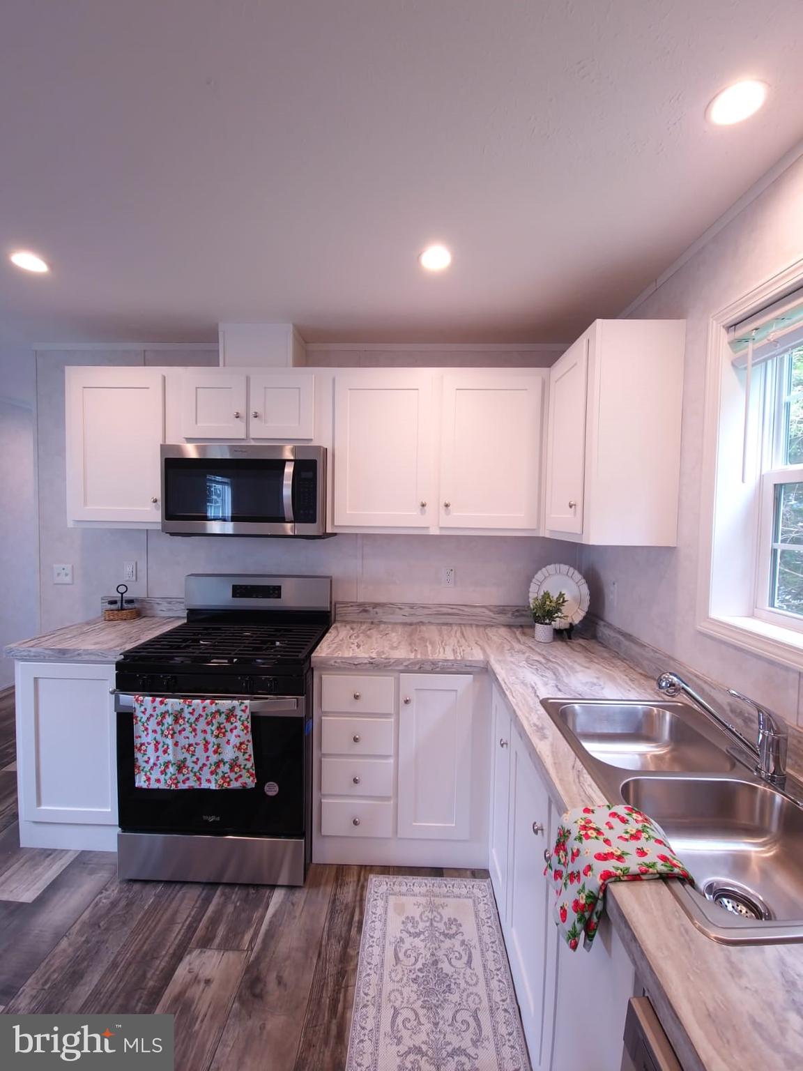 13 Montrose Boulevard Reading, PA 19607 - Photo 12 of 28 a kitchen with stainless steel appliances granite countertop a sink stove and cabinets