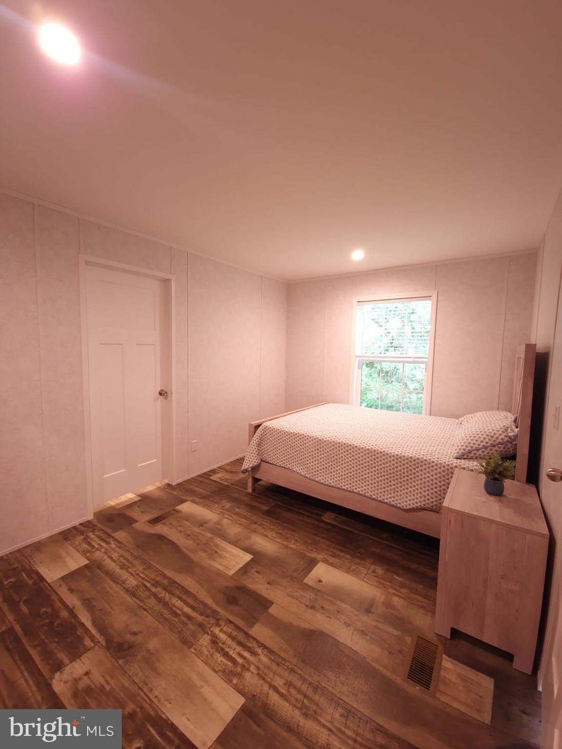 13 Montrose Boulevard Reading, PA 19607 - Photo 17 of 28 a bedroom with a bed and wooden floor