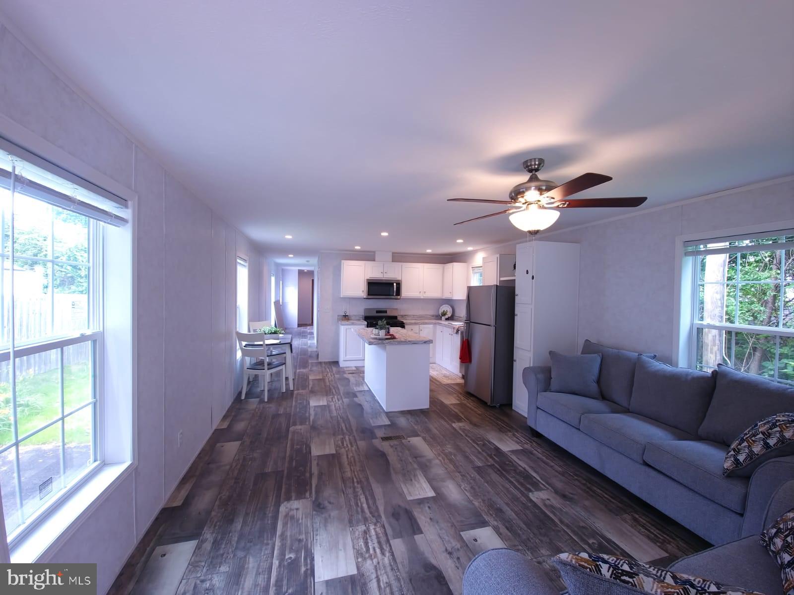 13 Montrose Boulevard Reading, PA 19607 - Photo 5 of 28 a living room with couches and kitchen view with wooden floor