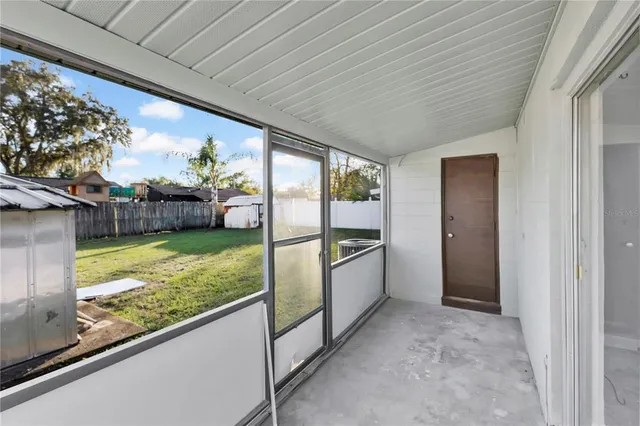 a view of a porch and garden