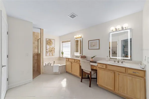 a room with sink and mirror
