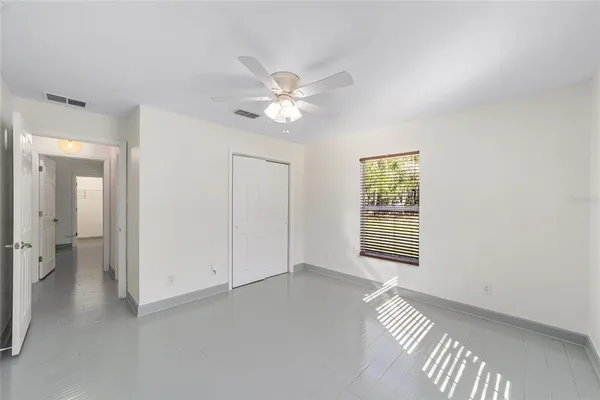a view of an empty room with a window