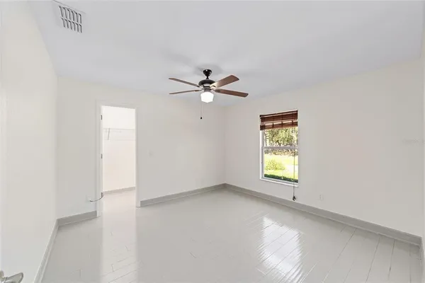 a view of an empty room with a window