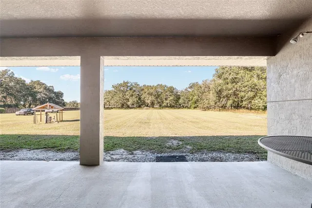 a view of a porch with a yard