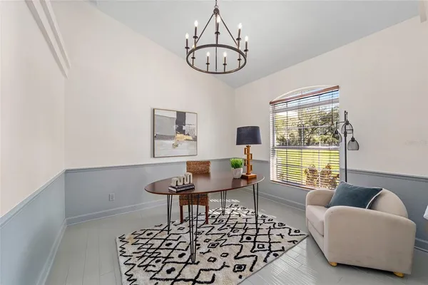 a living room with furniture a table and a window