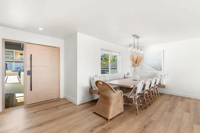 a large bed sitting in a bedroom next to a lamp