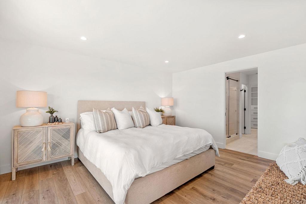 2172 Oxford Avenue Cardiff-by-the-Sea, CA 92007 - Photo 15 of 68 a bedroom with a bed and a lamp