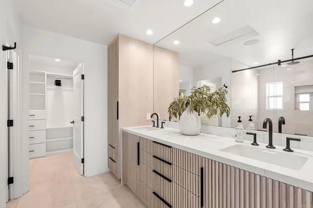 a view of a chairs and table in patio with a barbeque