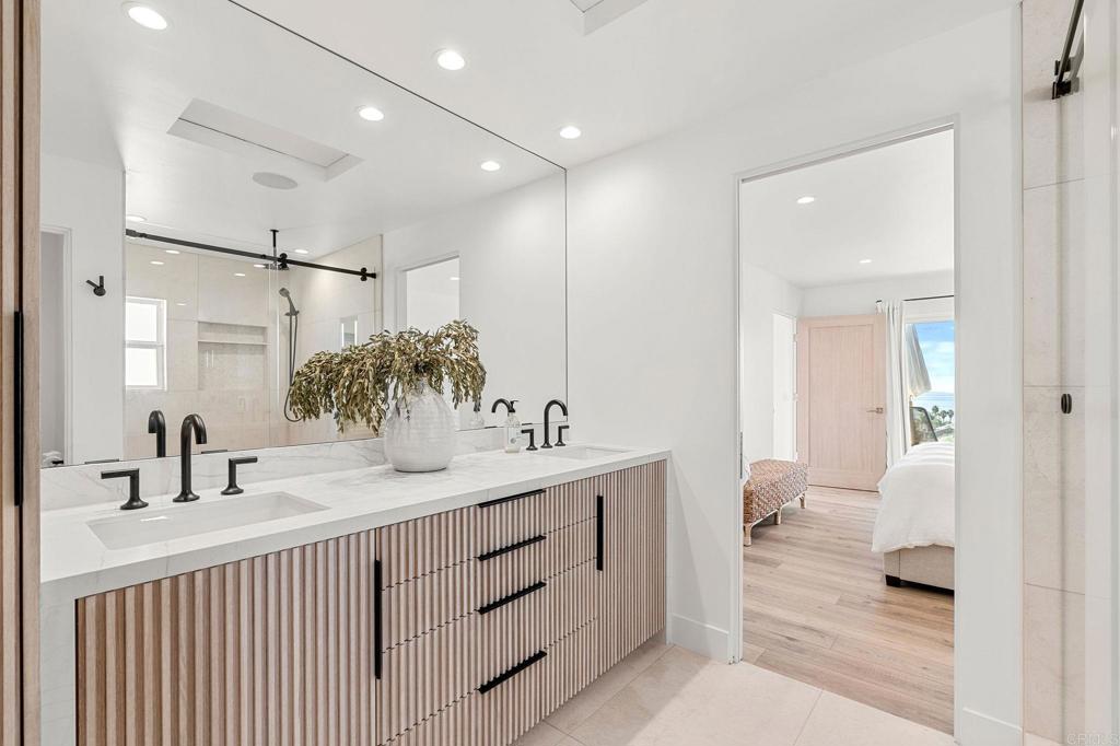 2172 Oxford Avenue Cardiff-by-the-Sea, CA 92007 - Photo 17 of 68 a bathroom with a sink and a mirror