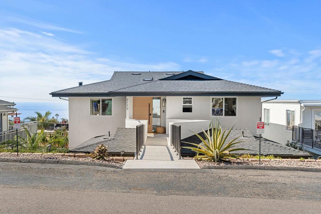 2172 Oxford Avenue Cardiff-by-the-Sea, CA 92007 - Photo 22 of 68 front view of a house with a bench and potted plants