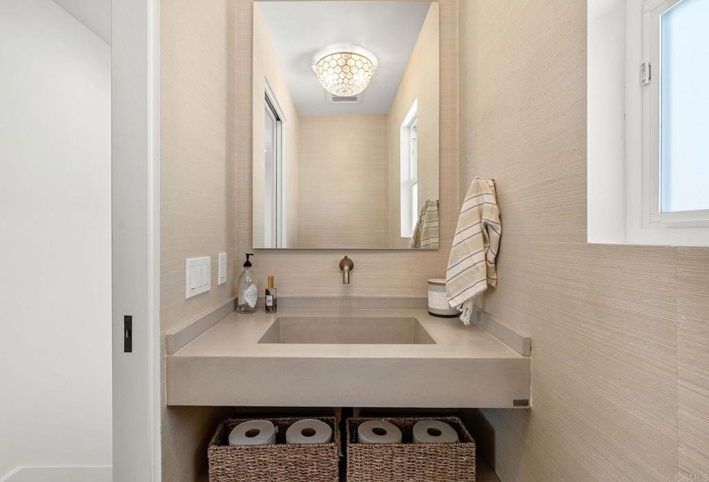 2172 Oxford Avenue Cardiff-by-the-Sea, CA 92007 - Photo 25 of 68 a bathroom with a sink and a mirror