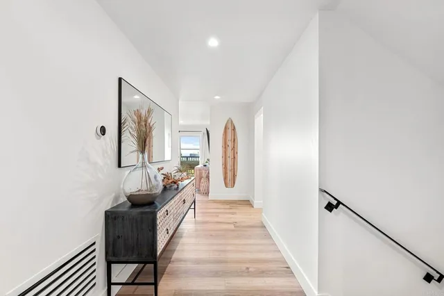 a living room with furniture a dining table and a potted plant