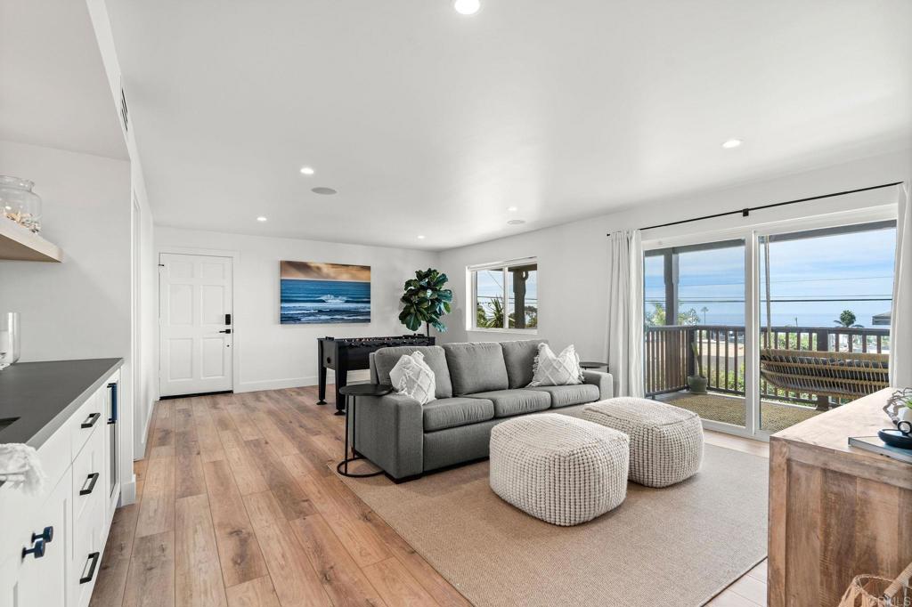 2172 Oxford Avenue Cardiff-by-the-Sea, CA 92007 - Photo 31 of 68 a living room with furniture and a flat screen tv