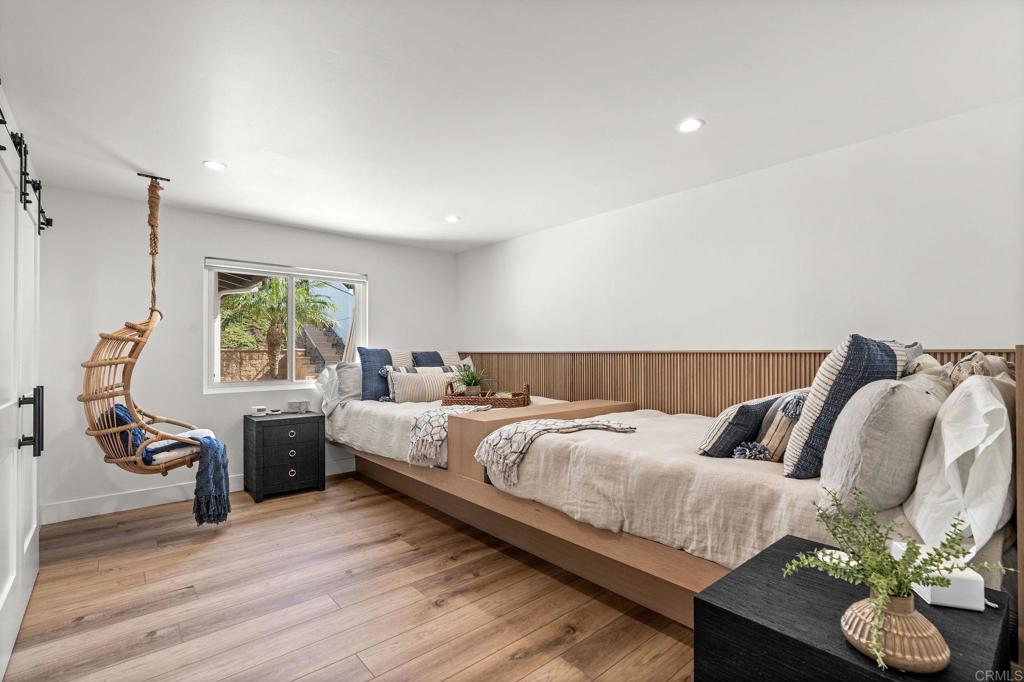 2172 Oxford Avenue Cardiff-by-the-Sea, CA 92007 - Photo 39 of 68 a bedroom with bed and window