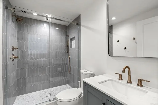 a bathroom with a bathtub and a shower