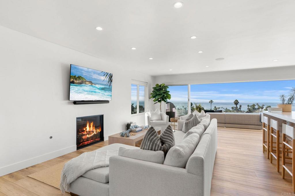 2172 Oxford Avenue Cardiff-by-the-Sea, CA 92007 - Photo 6 of 68 a living room with furniture and a fireplace
