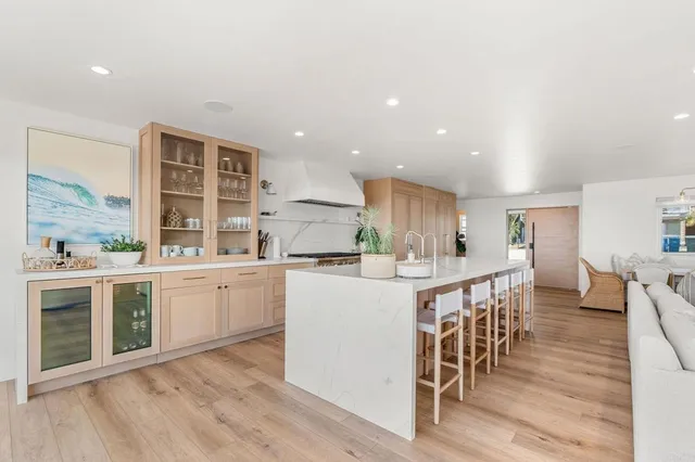 a kitchen with stove and cabinets