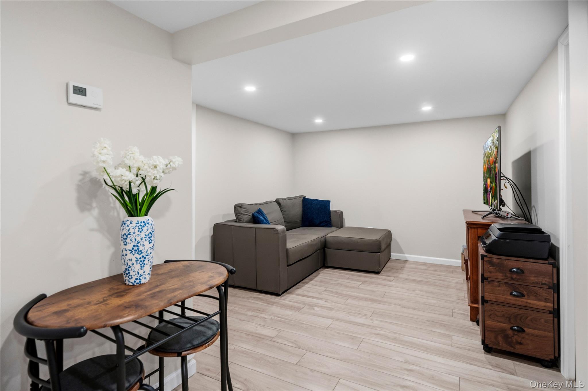 190 Sexton Road West Babylon, NY 11704 - Photo 23 of 28 a living room with furniture and a flat screen tv