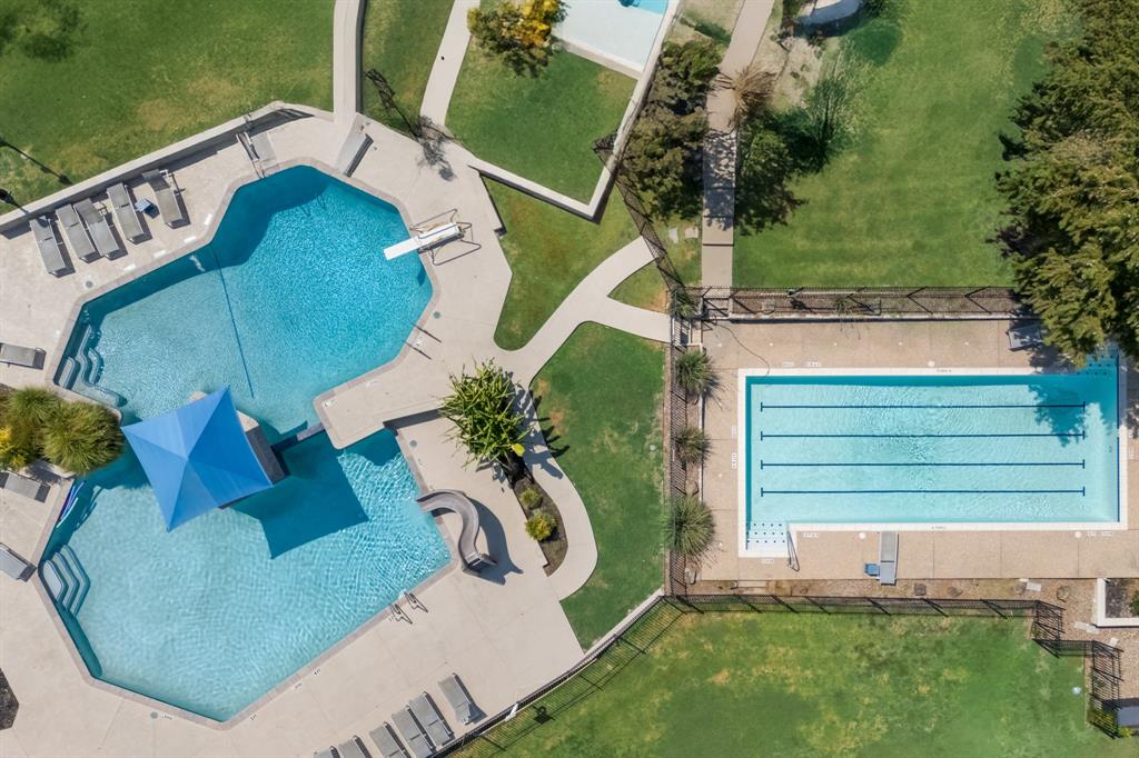 403 Riva Ridge Wylie, TX 75098 - Photo 27 of 32 Expansive outdoor area featuring two distinct pools, concrete pool decks, a diving board, and a water slide