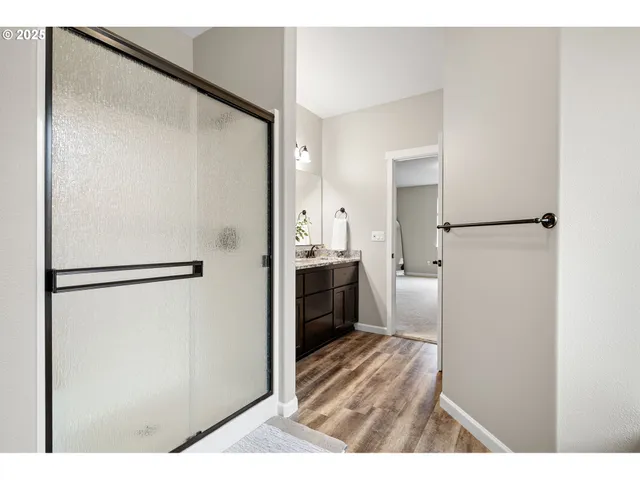 a spacious bedroom with a bed and a cabinets