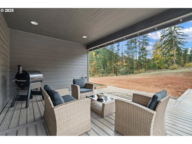 a view of a wooden house with a yard